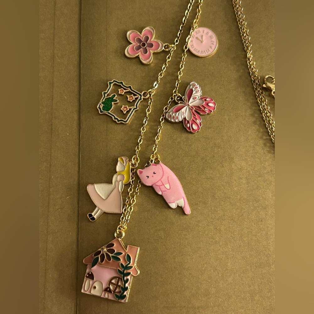 NWOT Necklace Alice in Wonderland, pink enamel charms rabbit, flower, cat… 23”